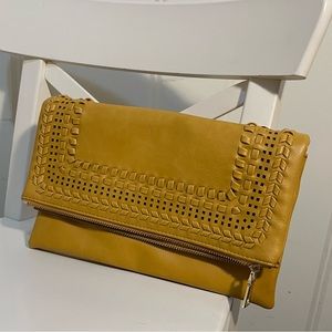 Yellow faux leather clutch. Measures 11x6 when folded.